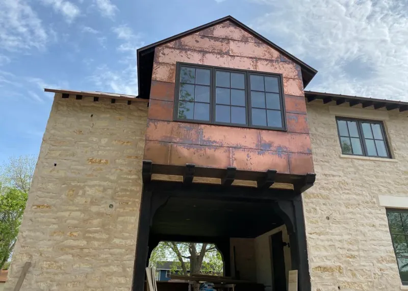 Copper metal panel facade on a stone building for Skylight Installation in Brooklyn Park