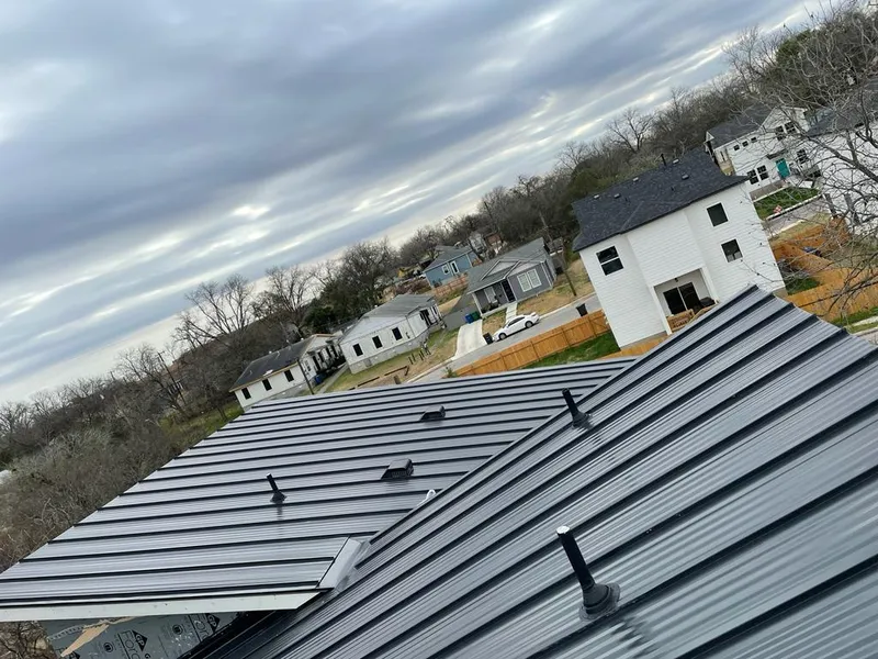 Standing seam metal roof panels with vents for Skylight Repair in Brooklyn Park